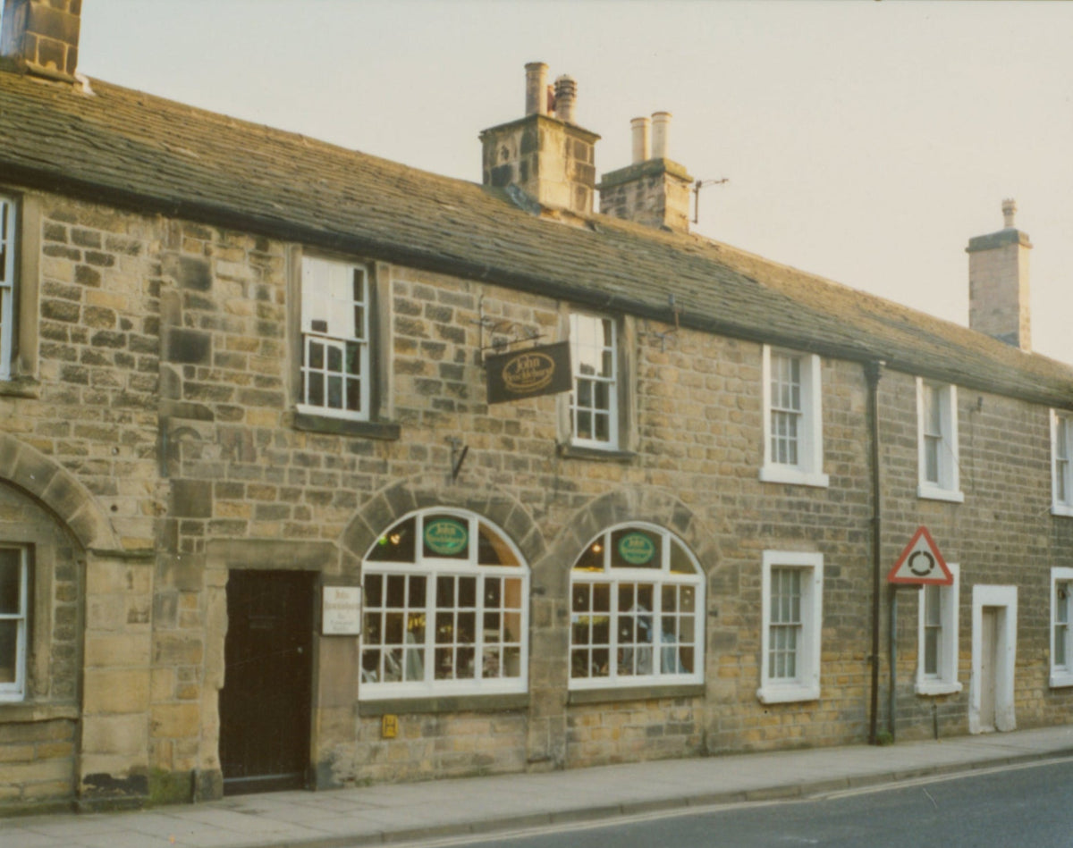 Early photograph of the original Brocklehursts shop on Bridge Street in Bakewell, showing the historic stone storefront and shop windows.