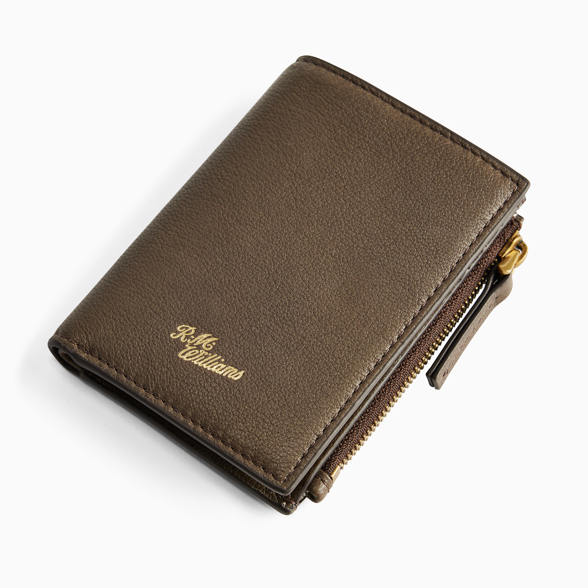 Angled view of the R.M. Williams Ranger Wallet in Khaki, showing the textured leather, gold script logo and zipped side compartment.