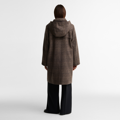 Model viewed from the back wearing the Barbour Melody Check Wool Duffle Coat in brown, showcasing the detachable hood and back vent for ease of movement.